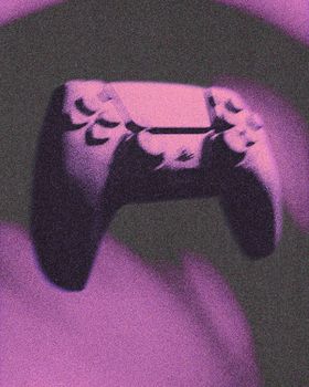 Artistic abstract image featuring a purple video game controller with bold styling.